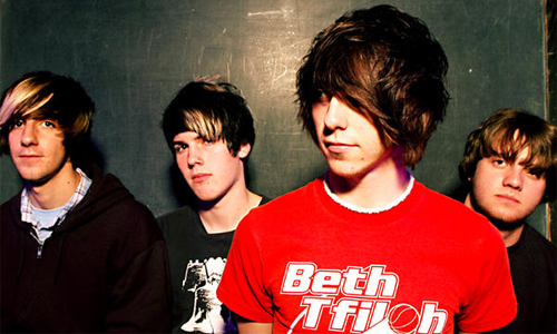 "Hello, we're All Time Low. We know you're tempted to knock our jaws out with a crowbar right now, but please, wait until you've heard us sing first. Then you'll probably want to sacrifice us to some evil deity instead."